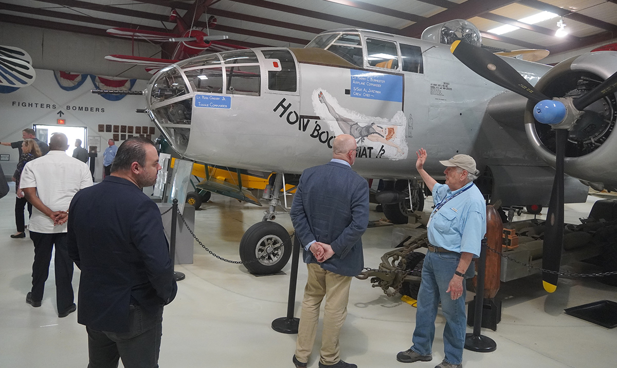 Guests at our Boeing Operators Forum visit next to a B-25H Mitchell bomber 